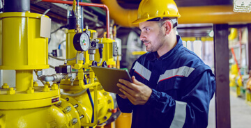 Technician providing maintenance services for mechanical equipment